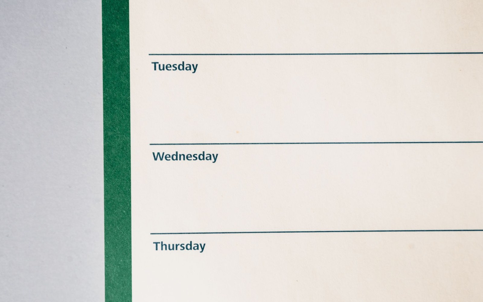 Blank weekly planner page showing printed labels for Tuesday, Wednesday, and Thursday